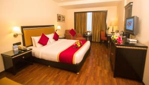 a hotel room with a bed with flowers on it at Fortune Park JP Celestial, Bengaluru - Member ITC's Hotel Group in Bangalore