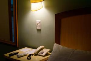 Postel nebo postele na pokoji v ubytování Hotel Exclusivo