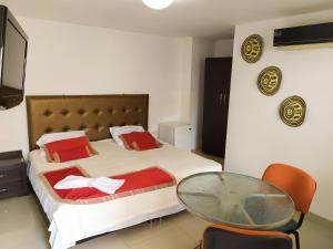 Postel nebo postele na pokoji v ubytování Hotel Plaza Colonial + 37 fotografií
