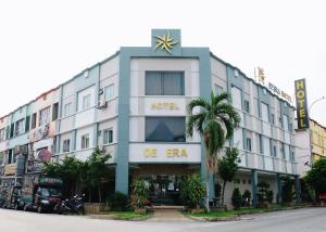 a building with a star on the top of it at De Era Hotel in Seri Kembangan