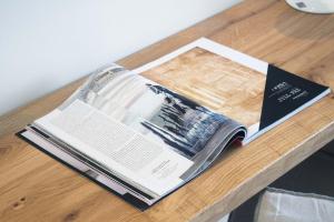 an open book sitting on a table at Armonia Bay Hotel in Kokkari