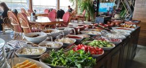 a buffet with many dishes of food on a table at Safran Cave Hotel in Göreme