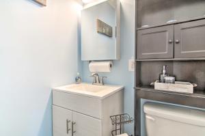 a bathroom with a sink and a toilet at 1 Mi to Beach Waterfront Retreat in Ocean City in Ocean City +27 photos