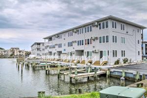 a building on a dock next to a body of water at 1 Mi to Beach Waterfront Retreat in Ocean City in Ocean City