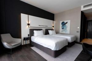 Postel nebo postele na pokoji v ubytování Hotel Bonvie