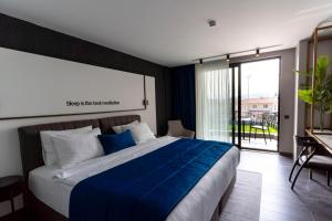 Postel nebo postele na pokoji v ubytování Hotel Bonvie