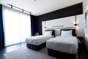 Postel nebo postele na pokoji v ubytování Hotel Bonvie