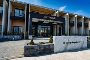 a building with a sign for a hotel room at Hotel Bonvie in Sakarya