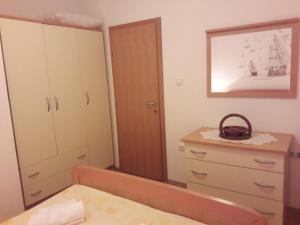 Postel nebo postele na pokoji v ubytování Apartmani Prpić
