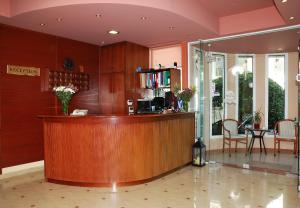 a lobby with a reception desk in a building at Ilion in Loutraki