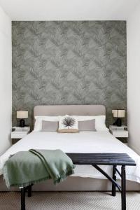 Ένα ή περισσότερα κρεβάτια σε δωμάτιο στο Elegante appartamento minimal dai tocchi botanici