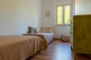 Posteľ alebo postele v izbe v ubytovaní In collina sul mare...