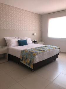 Postel nebo postele na pokoji v ubytování San Martin Cartagena