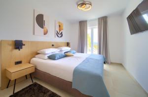 Postel nebo postele na pokoji v ubytování Villa Allegra + 37 fotografií