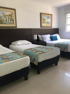 Postel nebo postele na pokoji v ubytování San Martin Cartagena