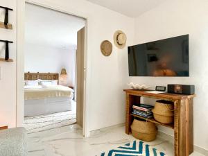 a bedroom with a mirror and a bed at Jávea Apartment Cielo in Jávea