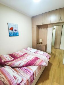 Voodi või voodid majutusasutuse Apartmani Sigma toas