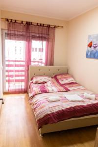 Voodi või voodid majutusasutuse Apartmani Sigma toas