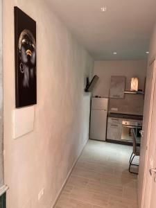 a hallway leading to a kitchen and a living room at Moonlight Apartament in Campo nell'Elba