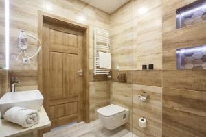 a bathroom with a toilet and a sink and a shower at PIANISSIMO in Krakow +12 photos
