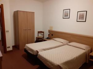 Postel nebo postele na pokoji v ubytování Albergo Ristorante Cicin