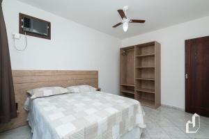 Krevet ili kreveti u jedinici u okviru objekta Casa com 03 dormitórios