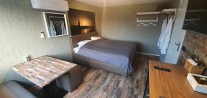 Postel nebo postele na pokoji v ubytování Bed & Budget Mackenzieplaats