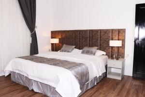 Postel nebo postele na pokoji v ubytování Mandreen Serviced Apartments + 26 fotografií