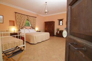 Postel nebo postele na pokoji v ubytování Villa Pardi