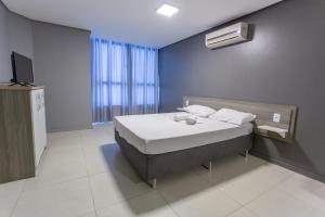 Postel nebo postele na pokoji v ubytování USEHOTEL - A uma quadra do complexo hospitalar Santa Casa