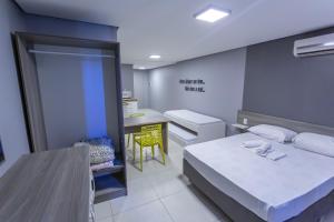Postel nebo postele na pokoji v ubytování USEHOTEL - A uma quadra do complexo hospitalar Santa Casa