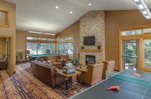 a living room with a pool table and a fireplace at WorldMark McCall in McCall