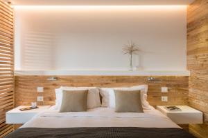 
Ένα ή περισσότερα κρεβάτια σε δωμάτιο στο Domotel Agios Nikolaos Suites Resort
