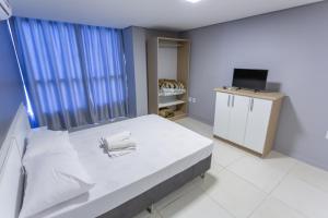 Postel nebo postele na pokoji v ubytování USEHOTEL - A uma quadra do complexo hospitalar Santa Casa