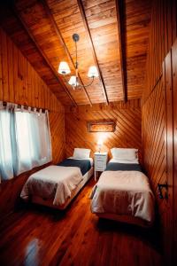Säng eller sängar i ett rum på Paraiso Patagónico Bungalows and Apart Hotel