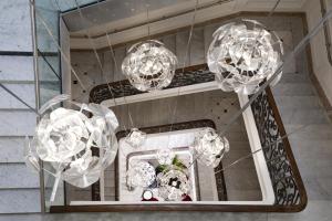 a group of chandeliers hanging in a room at Hotel C2 in Marseille