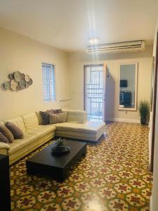 a living room with a couch and a table at Calle Hollanda 3 Bedroom Home in San Juan