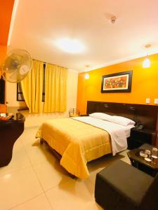 a hotel room with a bed and a fan at Royal Garden Hotel in Lima