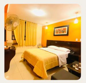 a hotel room with a bed and a fan at Royal Garden Hotel in Lima