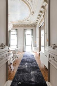 an ornate room with a ceiling and a black rug at Hotel C2 in Marseille