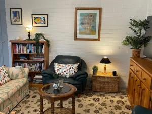 a living room with a couch and a chair at Stella Maris in Eden