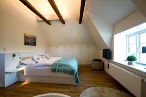 Ένα ή περισσότερα κρεβάτια σε δωμάτιο στο Reethus Glücklicher Matthias Hausteil Waasterlun