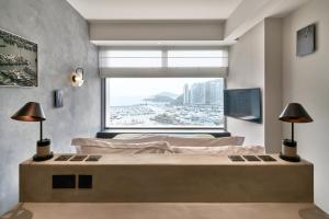 A bed or beds in a room at the Arca