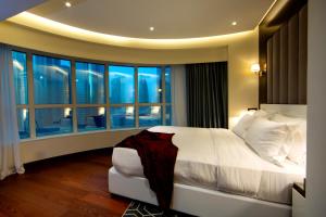 Katil atau katil-katil dalam bilik di Number One Tower Suites