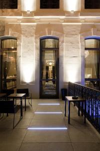 a room with tables and chairs in a building at Hotel C2 in Marseille