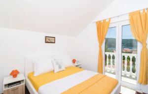 a bedroom with a bed and a large window at Bijela Villa in Slano +40 photos