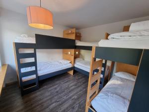 Postel nebo postele na pokoji v ubytování Hostel by Hyve Basel