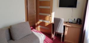 Postel nebo postele na pokoji v ubytování Hotel Dainava