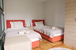 מיטה או מיטות בחדר ב-Apartman Marina Subotica