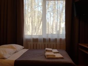 Postel nebo postele na pokoji v ubytování Hotel Dainava
